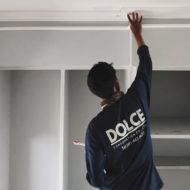 dolce worker repairing ceiling at a resort in phuket