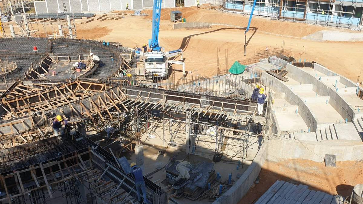 drone view steps to main building mid construction